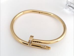 Aro clavo Cartier dorado con circonias