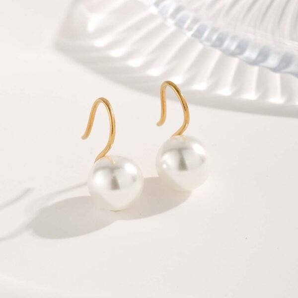 Aretes dorados perla colgante