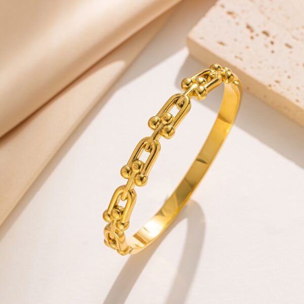 Aro dorado dupe Tiffany acero titanio con chapa de oro de 18k