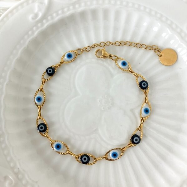 Pulsera dorada ojo turco azul y negro