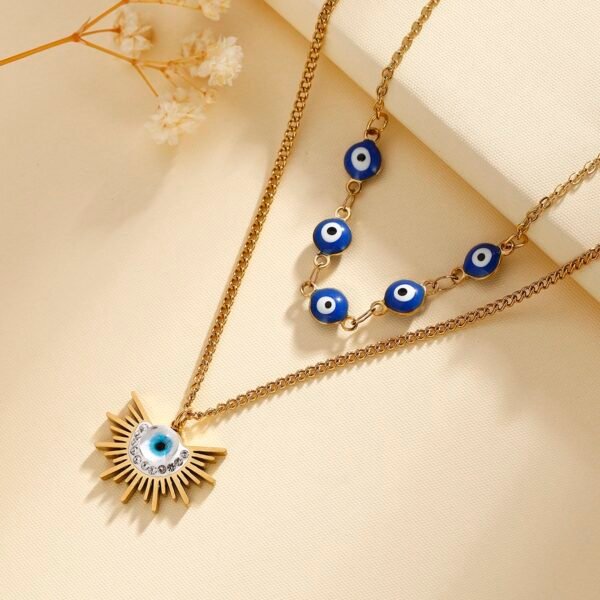 Collar dorado cadena doble ojos turcos en acero inoxidable