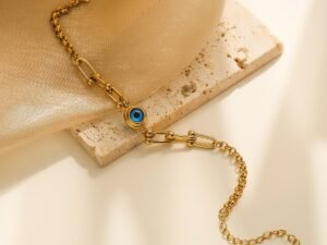 Pulsera dorada eslabón U ojo turco de acero inoxidable chapado en oro de 18k
