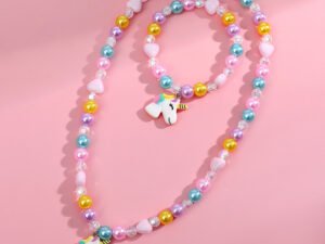 Set de niña con borlas de colores y dije de unicornio acrílico resina