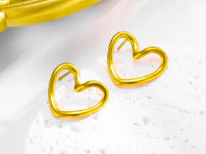 Aretes dorados corazón ahuecado acero inoxidable