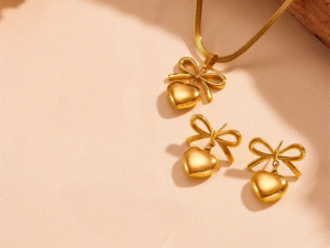 Set dorado moña corazón acero inoxidable chapado en oro de 18k