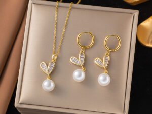Set dorado corazon con perla acero inoxidable