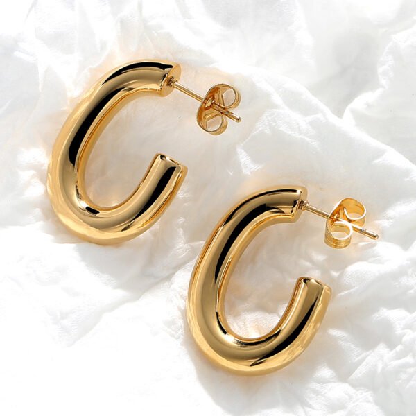 Arete dorado forma C acero inoxidable chapado en oro 18k