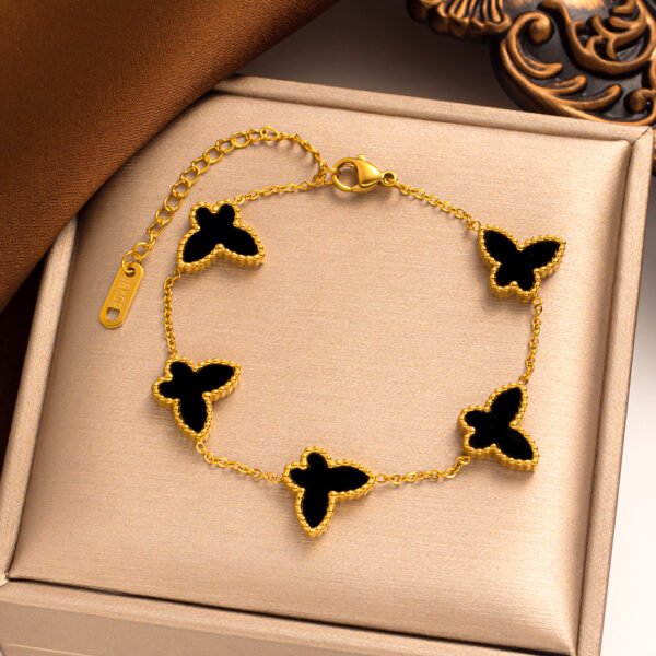 Pulsera dorada mariposas negras Acero titanio