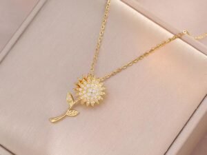 Collar dorado girasol giratorio picos circonias acero titanio