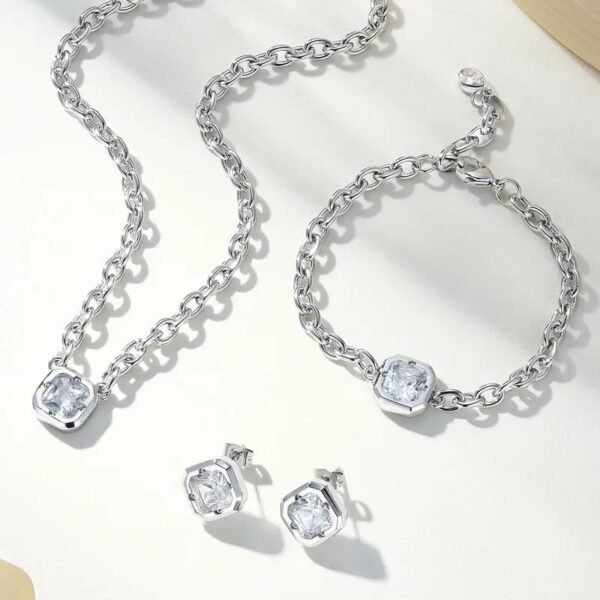 Set plateado eslabones y circonia