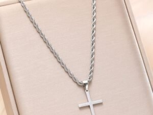 Cadena plateada unisex cruz lazo 60 cm x 3mm