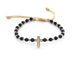 Pulsera cruz ajustable borlas negras chapado en oro de 18k