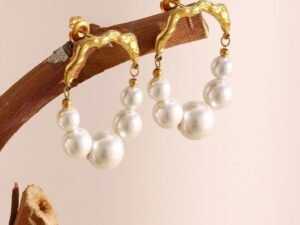 Aretes ovalados perlas y labrado dorado  acero inoxidable