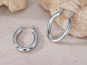 Argollas ovaladas plateadas acero titanio chapado en oro