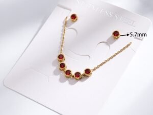 Set con circonias rojas acero inoxidable chapado en oro